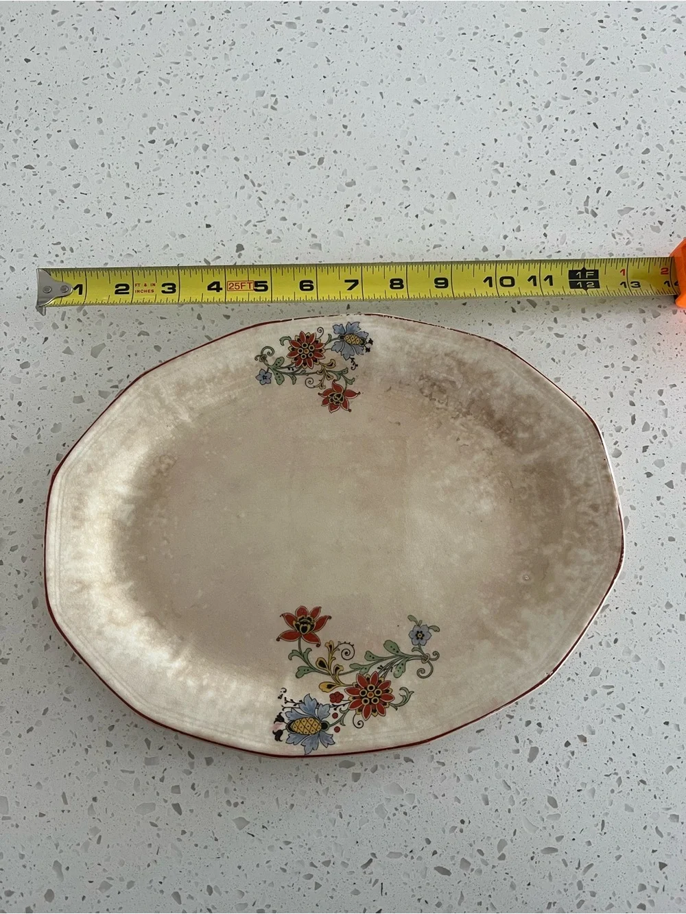 Antique Cream Oval Serving Platter with Rusty Red and Blue Floral Accents.